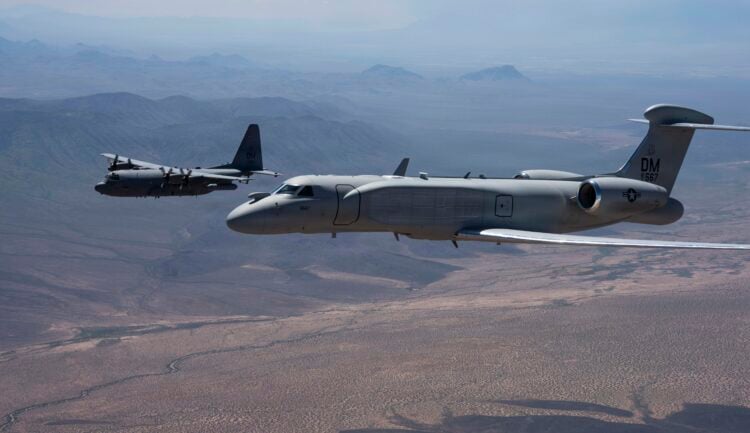 A U.S. Air Force EC-130H Compass Call aircraft and an EA-37B Compass Call aircraft assigned to the 55th Electronic Combat Group fly in formation over Southern Arizona, Sept. 3, 2026. Together in formation for the first time, the aircraft symbolize the continuation of a critical combat capability that enables U.S. and coalition forces to disrupt, deny and degrade adversary command and control networks. (U.S. Air Force photo by Senior Airman Devlin Bishop)