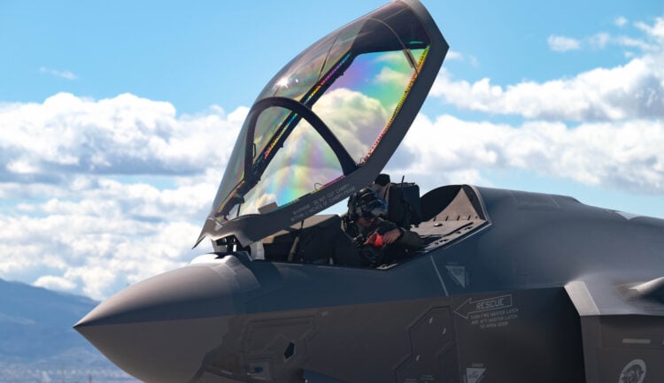 U.S. Air Force Maj. Zach Saunders, an F-35 division commander assigned to the 422nd Test and Evaluation Squadron, opens the canopy on an F-35 Lightning II after arrival at Nellis Air Force Base, Nevada, April 1, 2024. Saunders is engaging in Independent Pilot Off-station Procedures, which allows for aircrew to independently inspect and deploy their aircraft. (U.S. Air Force photo by Airman 1st Class Brianna Vetro)