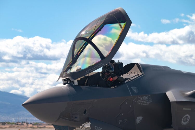 U.S. Air Force Maj. Zach Saunders, an F-35 division commander assigned to the 422nd Test and Evaluation Squadron, opens the canopy on an F-35 Lightning II after arrival at Nellis Air Force Base, Nevada, April 1, 2024. Saunders is engaging in Independent Pilot Off-station Procedures, which allows for aircrew to independently inspect and deploy their aircraft. (U.S. Air Force photo by Airman 1st Class Brianna Vetro)